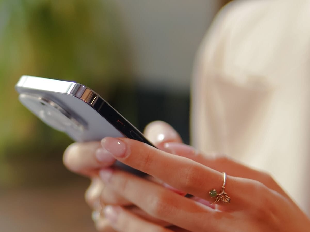 a close up of a person holding a cell phone